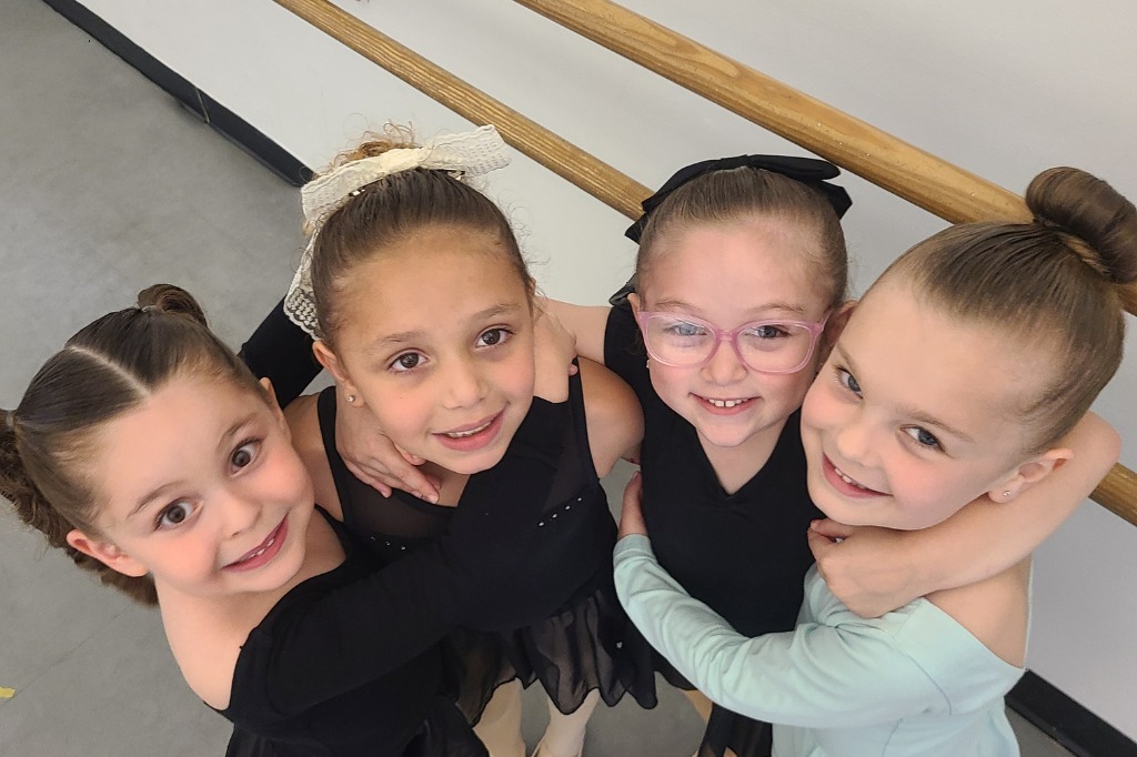 hero-slide2-1080x500 four young dancers hugging